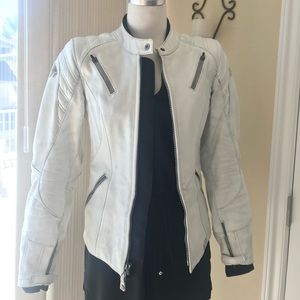 Motorcycle riding jacket. Fits size 2 and a snug 4